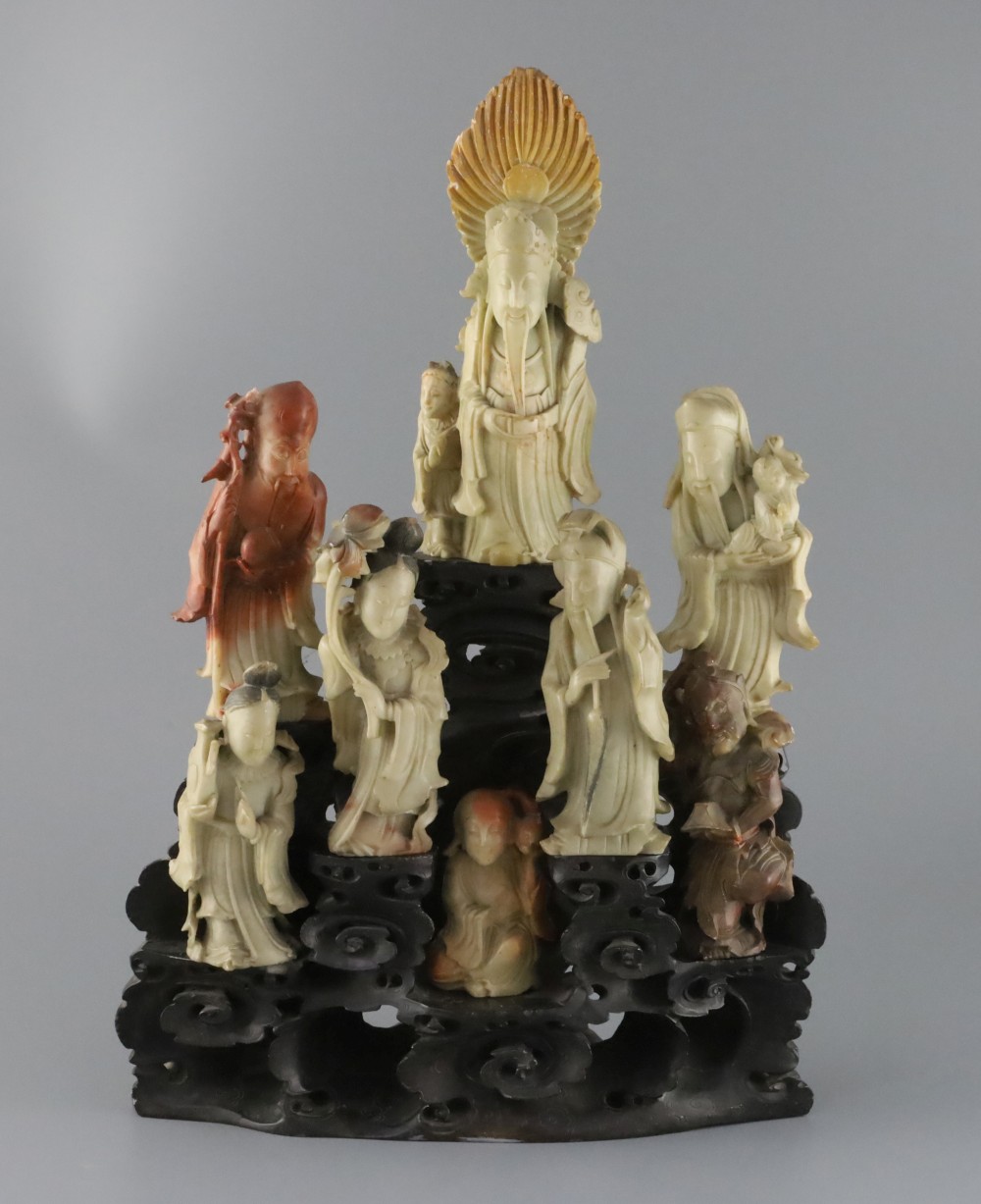 A Chinese soapstone group of eight immortals, late 19th / early 20th century,